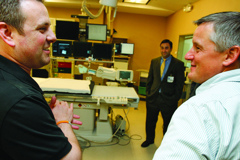 Tour: Taylor Thompson, Director of Cardiovascular Services at the Medical Center of South Arkansas, discuses the hospital’s Cardiac Cath-Lab with U.S. Rep. Bruce Westerman (R-Ark.), right, and MCSA COO Ross Korkmas, center right, during a tour on Tuesday.