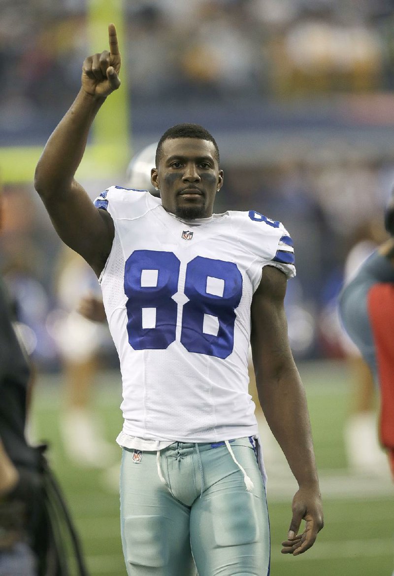 Dallas Cowboys wide receiver Dez Bryant (88) points to the sky in this file photo.