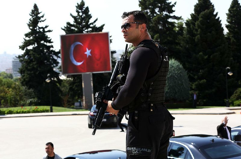 A Turkish special security force member stands guard Tuesday at the mausoleum of Turkey founder Kemal Ataturk as Prime Minister Binali Yildirim, military commanders and ministers pay their respects. 