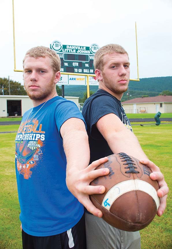 Sophomores Eli Lane, left, and his identical twin brother, Evan, are ready to take the field for the Danville Little Johns. Eli was sidelined last year with a broken collarbone. The 15-year-olds have played football, baseball and basketball together. Their father, Mark, played football for Danville, as did their older brother, Alec. “As for learning the game, we did that by watching and playing with our older brother since we were very young,” Eli said.