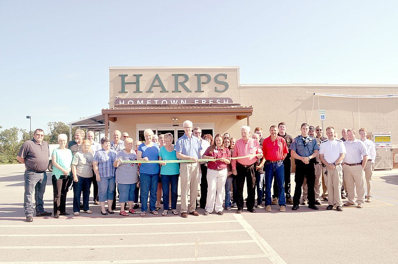 Community members gathered for a ribbon cutting at the new Harps in Seligman on Wednesday.