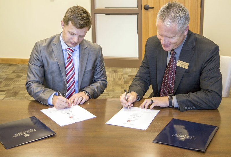 Photo submitted Jason Morrison, CASC&#x2019;s vice president for academic affairs, and Ed Ericson, JBU&#x2019;s vice president for academic affairs, signed an articulation agreement on Friday, which gives students the opportunity to continue their educational careers by transferring courses from CASC to JBU.