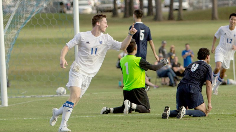 Photo courtesy of JBU Sports Information John Brown University sophomore Conner Haney, No. 11, celebrates after scoring in the 83rd minute to give the Golden Eagles their final goal in a 3-0 win against Lyon on Saturday at Alumni Field.