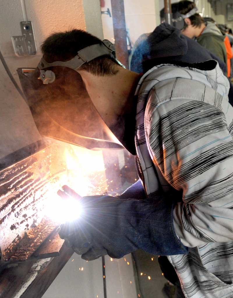 Photo by Andy Shupe Denver Dishon, 17, a junior at Siloam Springs High School, practices welding with an arc welder Friday, Aug. 19, at the Career Academy at Siloam Springs High School.