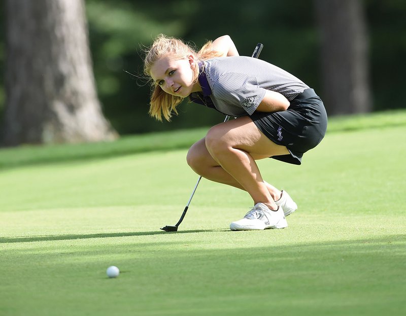 Fayetteville High golfer Anna Karen Witte reacts as she just misses a putt Tuesday during a triteam match with Rogers Heritage and Siloam Springs at Paradise Valley golf course in Fayetteville.