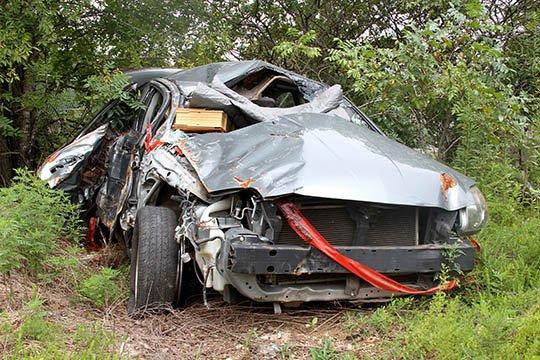 The Sentinel-Record / Max Bryan TAINTED: The mercury-tainted 2009 Mitsubishi Galant that crashed in a Hot Springs Advertising and Promotion Commission parking lot in the 300 block of Malvern Avenue on May 16 currently sits marked off in Combs & Burks Wrecker Service's impound lot.