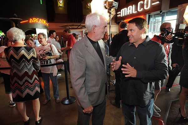 Former Harrison football coach Tommy Tice (center) speaks Tuesday, Aug. 23, 2016, with producer Brian Reindl during a red carpet event ahead of the premiere of the movie "Greater" at the Malco Razorback Cinema 16 in Fayetteville. The movie, which opens Friday, tells the story of Brandon Burlsworth of Harrison who went from walk-on to All-American for the Razorback football team.