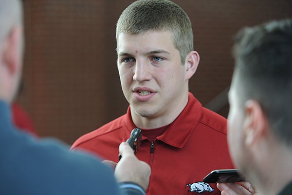 Rafe Peavey, a quarterback from Bolivar, Mo., answers questions during a National Signing Day ceremony Wednesday, Feb. 5, 2014, at the university's football complex.