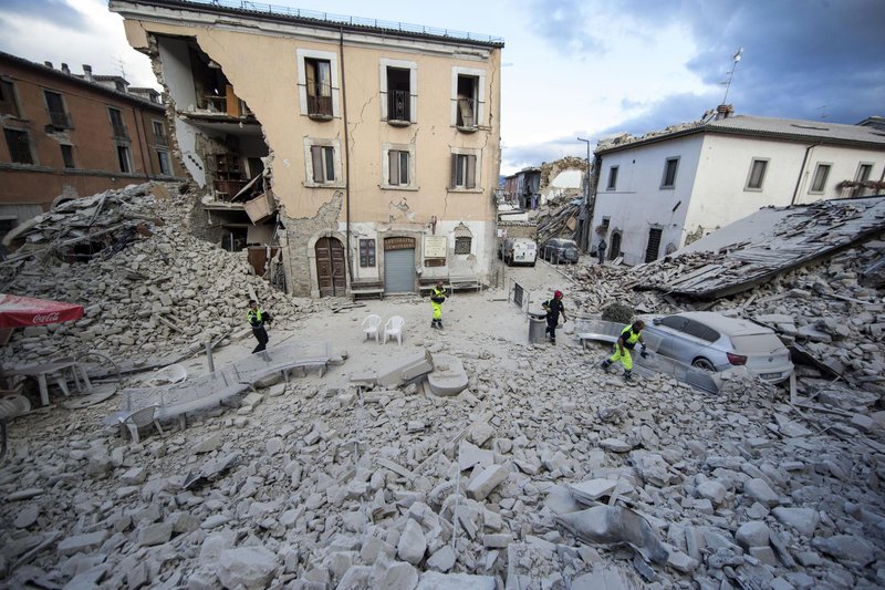 The side of a building is collapsed following an earthquake, in Amatrice Italy, Wednesday, Aug. 24, 2016. The magnitude 6 quake struck at 3:36 a.m. and was felt across a broad swath of central Italy, including Rome where residents of the capital felt a long swaying followed by aftershocks. (Massimo Percossi/ANSA via AP)
