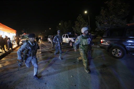 Afghan security forces rush to respond to an attack on the campus of the American University in the Afghan capital Kabul on Wednesday, Aug. 24, 2016.