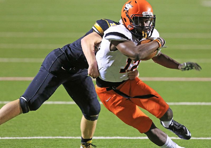 Nashville’s Darius Hopkins fights for extra yardage during the Scrappers’ 39-20 victory over Prairie Grove in the Class 4A championship game in December. Hopkins is one of 11 starters returning for the Scrappers as they look to defend their Class 4A title.