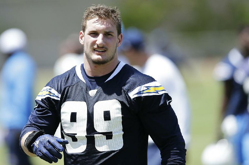 In this May 13, 2016, file photo, San Diego Chargers rookie defensive end Joey Bosa trains during an NFL football rookie training camp in San Diego. The Chargers have withdrawn their contract offer to first-round draft pick Joey Bosa and will restructure a new deal that takes into account his absence from the team.

