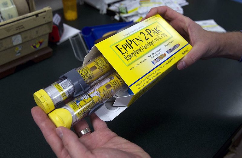 A package of EpiPens, an epinephrine injector for treatment of allergic reactions, is displayed in Sacramento, Calif., in this file photo. Lawmakers want to know why the price for the devices has risen 400 percent in recent years. 