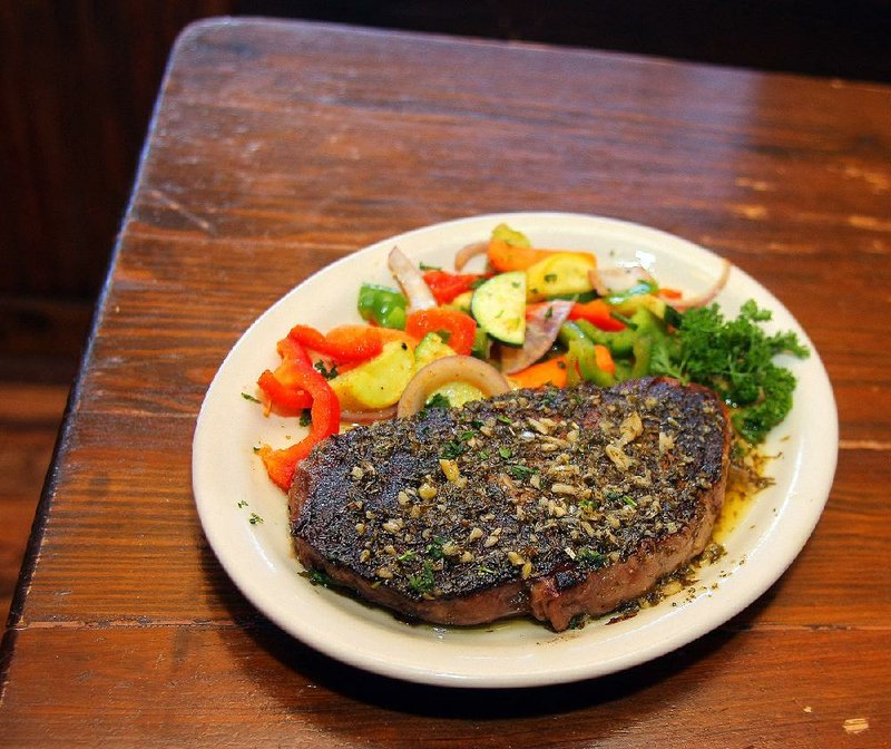 Ribeye ala Rosa at the Faded Rose is skillet-seared in olive oil and topped with chopped garlic and herbs. 
