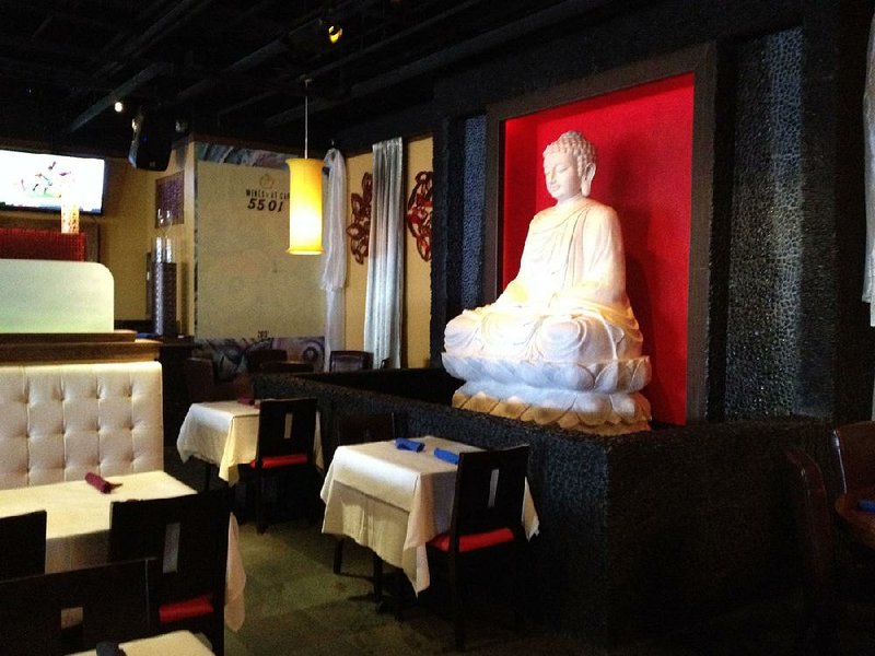 The Buddha statue that dominated the decor at the Heights restaurant, originally RJ Tao Restaurant & Ultra Lounge and subsequently at Cafe 5501 and Oishi Hibachi & Thai Cuisine, is gone as the space is in the process of becoming a sports/neighborhood bar called Prospect. 