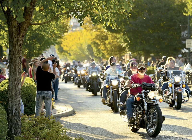 Bikers cruise Dickson Street during last year’s Bikes, Blues & BBQ motorcycle rally in downtown Fayetteville. This year’s roaring event, Sept. 22-24, benefits various nonprofit organizations in Northwest Arkansas.