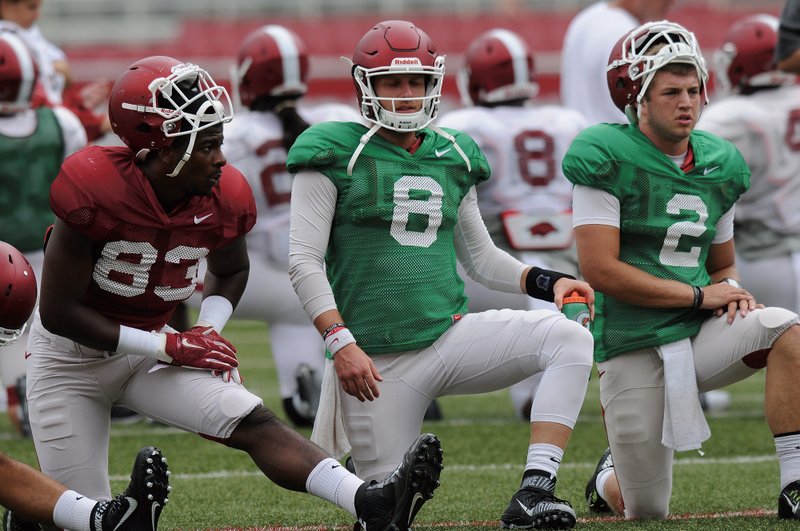 NWA Democrat-Gazette/Michael Woods TRANSFERRING: Arkansas reserve quarterback Rafe Peavey (2), shown with starters Jeremy Sprinkle (83) and Austin Allen (8), has informed Razorback coaches that he will transfer to SMU.