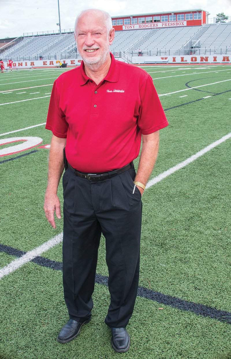 Vilonia School District Athletic Director and Assistant Superintendent Ed Sellers stands on the football field, where he has spent many hours. A former coach and principal, he said being athletic director is “very demanding” on his time, but he loves it. Sellers, who will turn 70 on Sept. 19, said he will retire at the end of the school year.