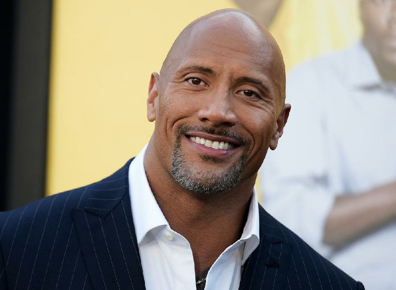 In this June 10, 2016 file photo, Dwayne Johnson attends the premiere of his film, "Central Intelligence"  in Los Angeles.   