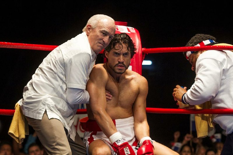 Trainer Ray Arcel (Robert De Niro) counsels the Panamanian world champion Roberto Duran (Edgar Ramirez) in the boxing bio-pic Hands of Stone.