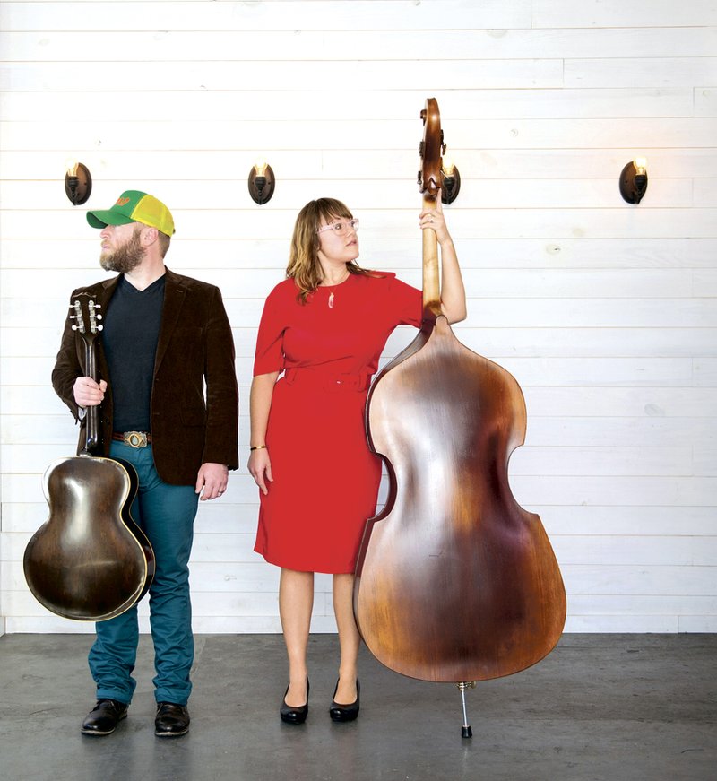 On the Cover: Bryan and Bernice Hembree of local musical group Smokey and the Mirror are two of the founders of the Fayetteville Roots Festival.