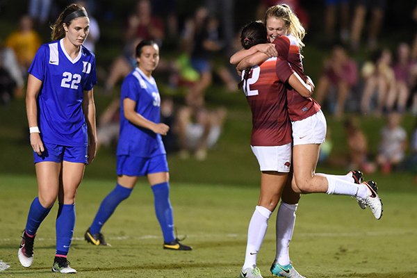 Arkansas' Stefani Doyle (17) celebrates with teammate Claire Kelley (12) after scoring a goal during the second half of a game against Duke on Friday, Aug. 26, 2016, at Razorback Field in Fayetteville. 