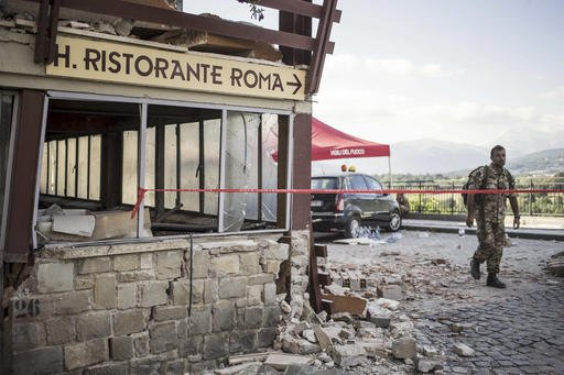 This picture taken on Wednesday, Aug. 24, 2016, shows the crumbling hulk of the Hotel Roma in Amatrice, central Italy, where a strong quake had hit a few hours earlier. 