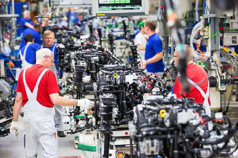 Employees work on the assembly line inside the Volkswagen factory in Wolfsburg, Germany, in May. 