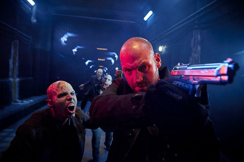 Look out! A trio of infected strigoi close in on Ephraim Goodweather (Corey Stoll) in The Strain. The thriller returns at 9 p.m. today on FX.