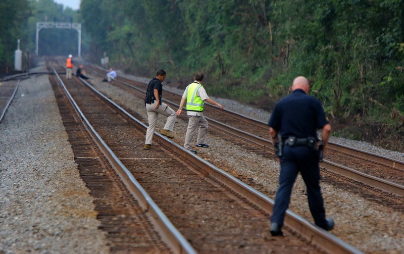 Law enforcement investigate a Union Pacific Railroad line northeast of South Redmond Road near Garvin Lane Wednesday afternoon in Jacksonville. Jacksonville police were called about 3:48 p.m. Thursday to the area where officers found a man with a head injury lying on the tracks, according to police spokesman April Kiser. 
