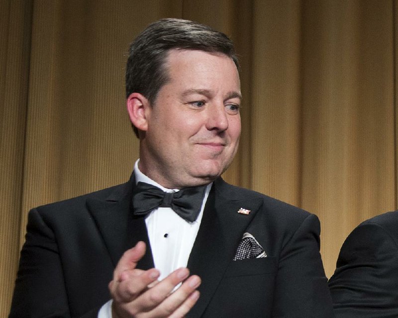 In this April 27, 2013, file photo, Ed Henry, Chief White House Correspondent for Fox News, applauds during the White House Correspondents' Association Dinner in Washington.