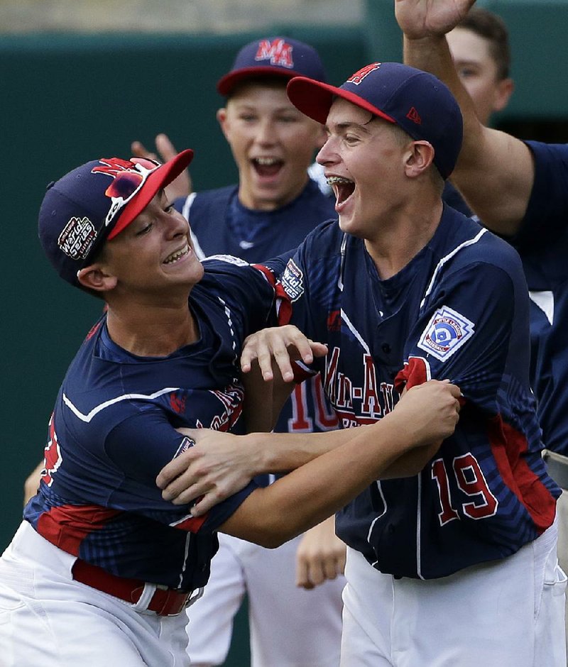 Ryan Harlost (right) of Endwell, N.Y., celebrates with teammate Jack Hopko after getting the final out in the
Little League World Series Championship against South Korea in South Williamsport, Pa., on Sunday.