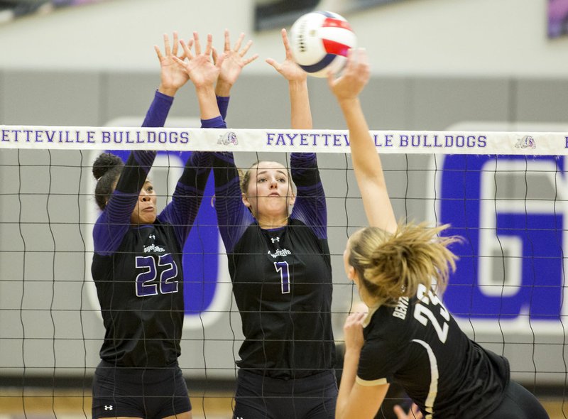 Fayetteville seniors Lauren Holmes (from left) and Oliva Wales attempt to block a shot on Monday from Bentonville junior Grayce Joyce at Fayetteville High School.