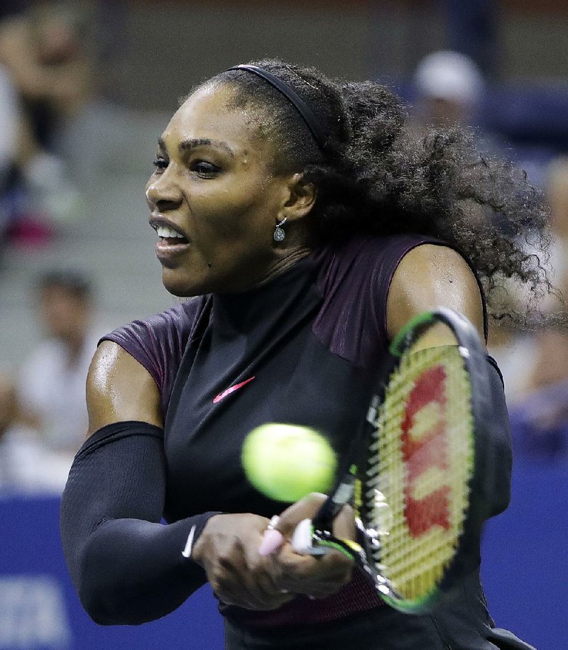 American Serena Williams returns a shot against Russia’s Ekaterina Makarova during their firstround match at the U.S. Open on Tuesday night in New York. Williams won 6-3, 6-3.