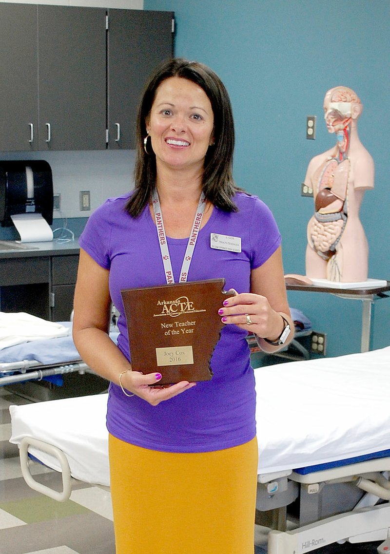 Janelle Jessen/Herald-Leader Joey Cox, a health-education teacher at Siloam Springs High School, was recently named Arkansas Association for Career and Technical Information teacher of the year.