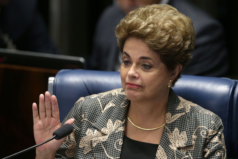 Suspended Brazilian President Dilma Rousseff waves goodbye after her impeachment trial at the Federal Senate in Brasilia, Brazil, Monday, Aug. 29, 2016. Rousseff's scheduled appearance during her impeachment trial is the culmination of a fight going back to late last year, when opponents in Congress presented a measure seeking to remove her from office. Her accusers say she hurt the economy with budget manipulations; she argues she did nothing wrong and is being targeted by corrupt lawmakers. (AP Photo/Eraldo Peres)