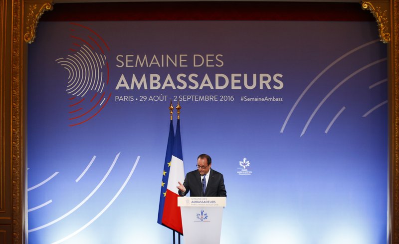 French President Francois Hollande gestures as he addresses French ambassadors, Tuesday Aug. 30, 2016 in Paris. 