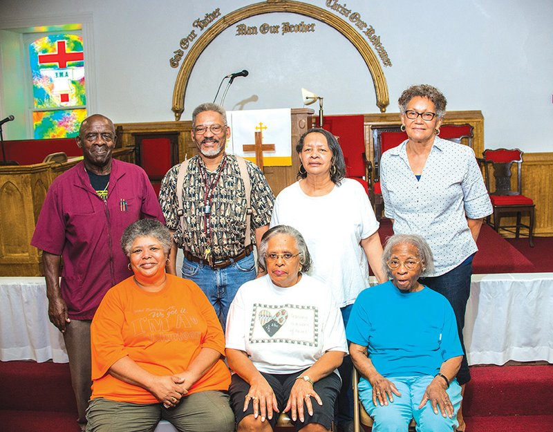Shown in the sanctuary of the historic Bethel African Methodist Episcopal Church in Batesville are, front row, from left, Vickie Anthony, JoAnn Cothrine and Junita Davis; and back row, Bobby Cothrine, Slayton Thompson, Pat Young and Jackie Earls. The church was added to the National Register of Historic Places in 1986 and will celebrate its 150th anniversary this week.