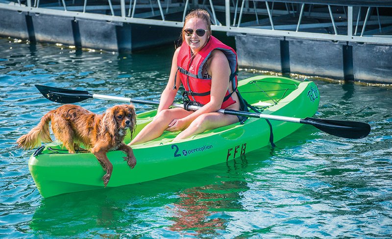 Johnnielynn Pace and her dog Rogan Rae are shown in a kayak that will be part of the Paddle Battle event Sept. 17 at Greers Ferry Lake in Fairfield Bay.