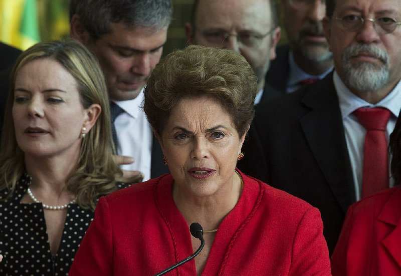 Dilma Rousseff speaks to supporters Wednesday from the official residence of the president in Brasilia, Brazil, after she was ousted from the presidency by the Senate vote. 
