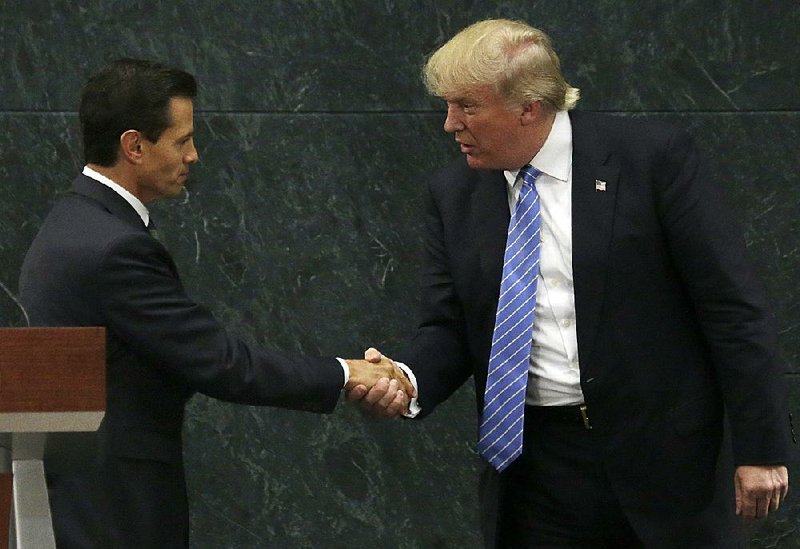 Mexican President Enrique Pena Nieto and Donald Trump part with a handshake Wednesday after their meeting in Mexico City.