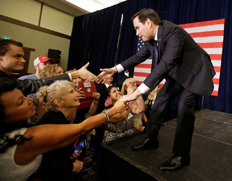 Sen. Marco Rubio, R-Fla., greets supporters Tuesday night in Kissimmee, Fla., after his primary victory. 
