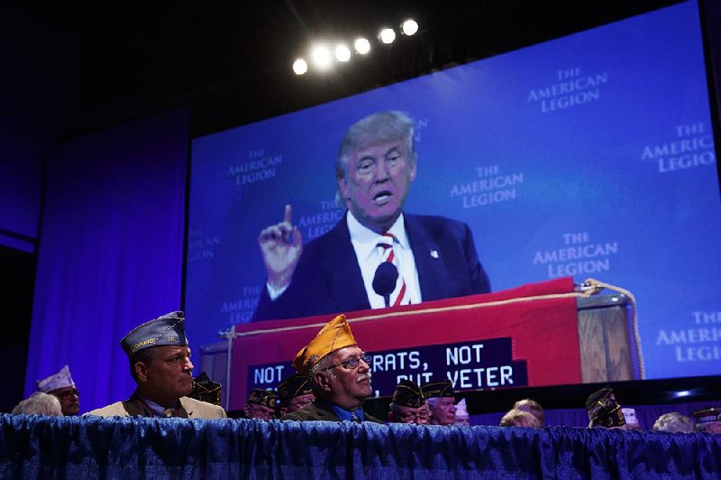 Donald Trump addresses the American Legion convention Thursday in Cincinnati, where he spoke of promoting “Americanism, not globalism.” 