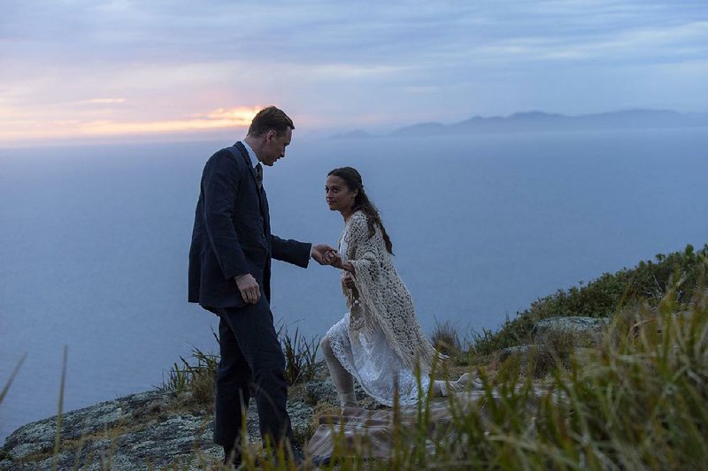 Lighthouse keeper Tom (Michael Fassbender) and his wife, Isabel (Alicia Vikander), living off the coast of western Australia raise a baby they rescue from an adrift rowboat in Derek Cianfrance’s The Light Between Oceans.