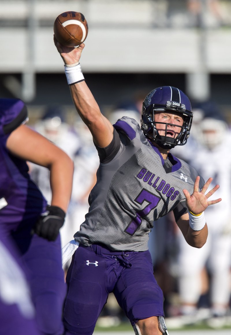 Fayetteville senior quarterback Taylor Powell looks to pass Aug. 22 during a scrimmage against Greenwood at Harmon Field in Fayetteville.