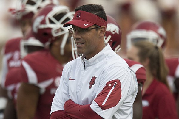 Arkansas offensive coordinator Dan Enos watches warmups prior to a game against Texas Tech on Saturday, Sept. 19, 2015, at Razorback Stadium in Fayetteville.