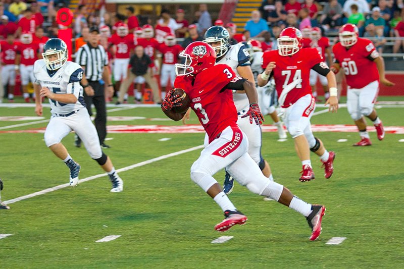 NWA Democrat-Gazette/MARK STALLINGS Derrick Wise of Northside gets outside of the Greenwood defense Friday in Forth Smith.