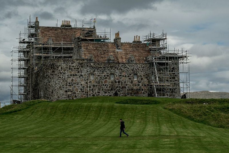 Scaffolding surrounds parts of the 14th-century Duart Castle, which sits on the wet and blustery Isle of Mull off the western coast of Scotland and is in a constant state of repair. 