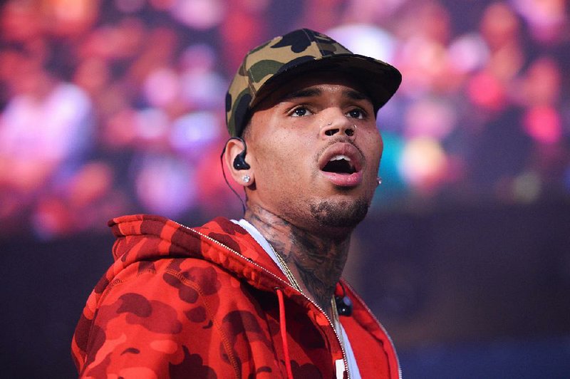 In this June 7, 2015, file photo, rapper Chris Brown performs at the 2015 Hot 97 Summer Jam at MetLife Stadium in East Rutherford, N.J. 