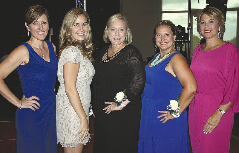 Meredith Wiktorowski (from left), Nevada Efird, Amy Combs, Heather Foitek and Andrea Morris, Fincher Foundation board members, welcome guests to a Cool Summer Homecoming.